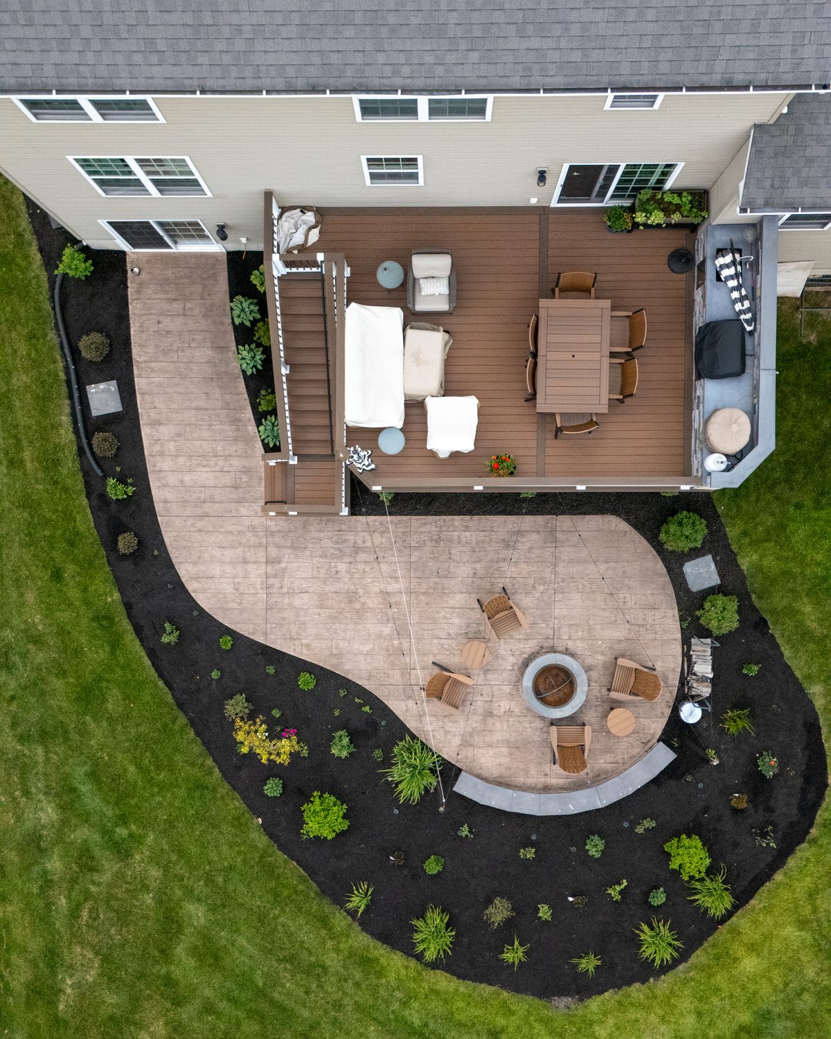 Aerial view of a paver patio and landscaped beds